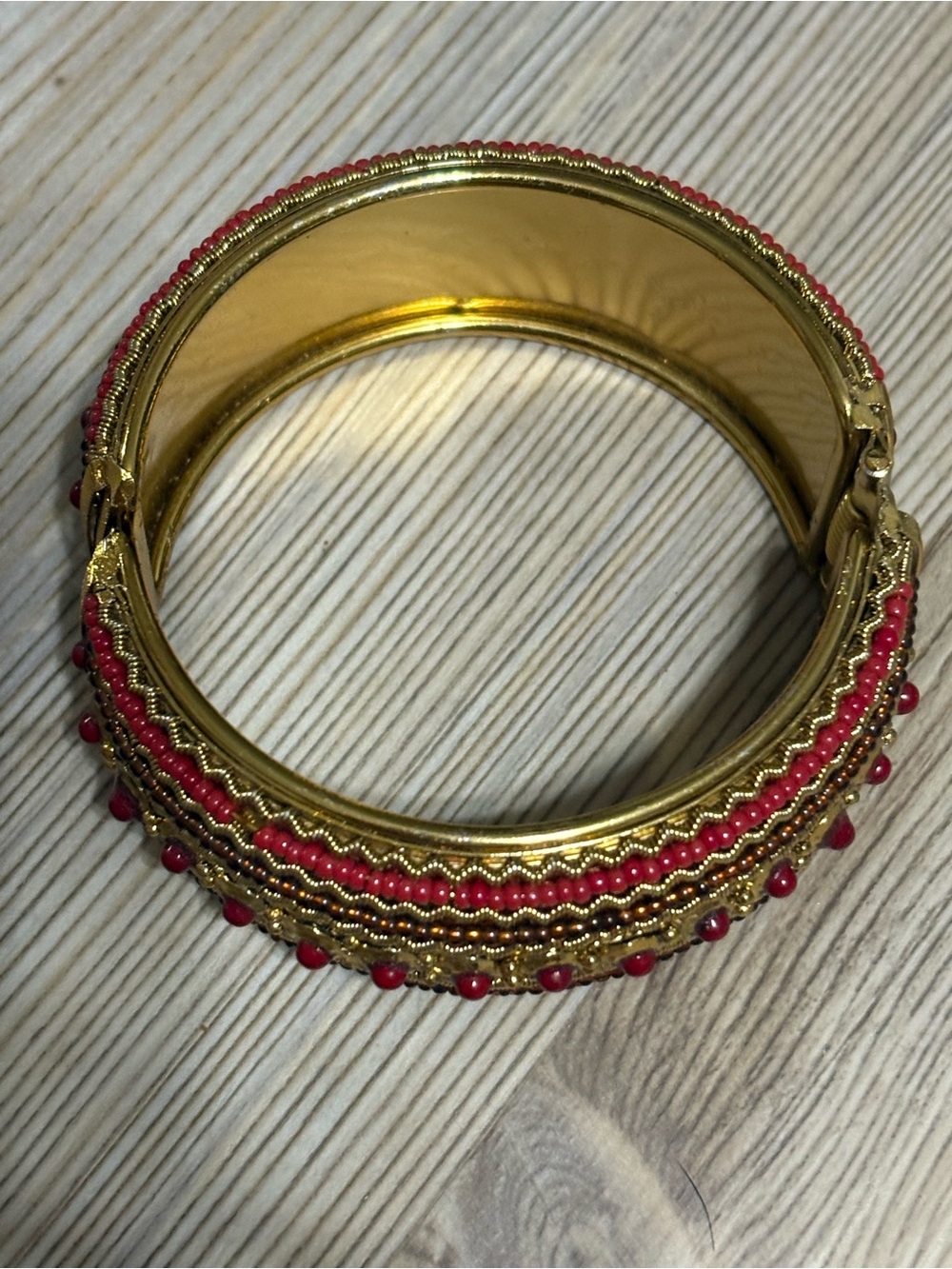 Gold-Tone Bangle Bracelet with Red Bead Accents